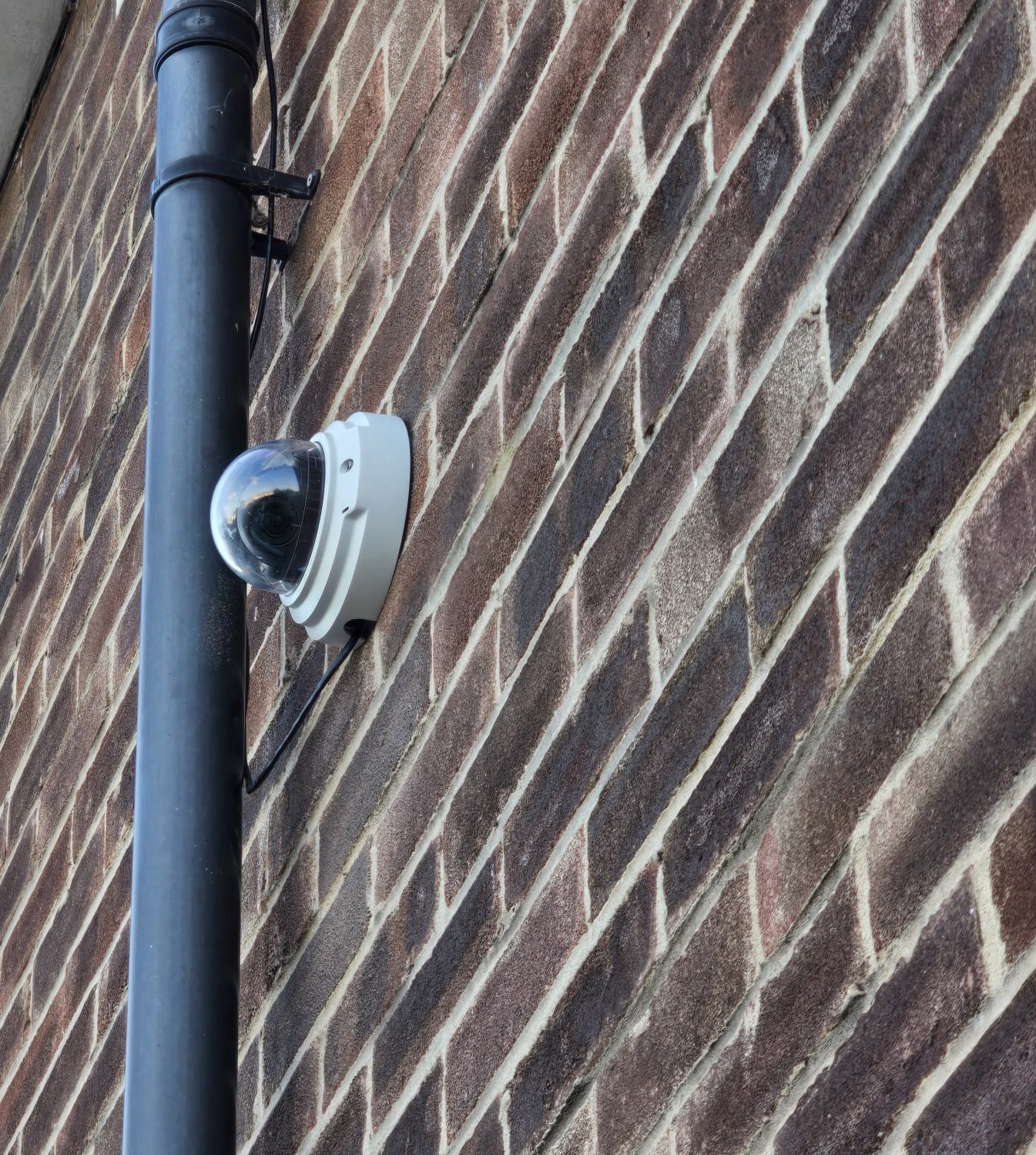 USCN Camera on Brick wall